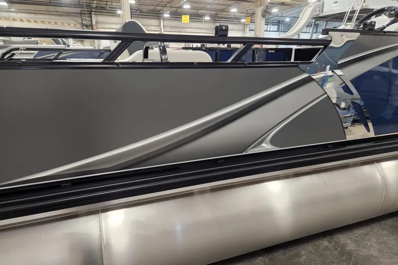 Slide: The Image of 2026 Tahoe Pontoon 25E85 LTZ with Mercury outboard motor, docked outdoors. - 7