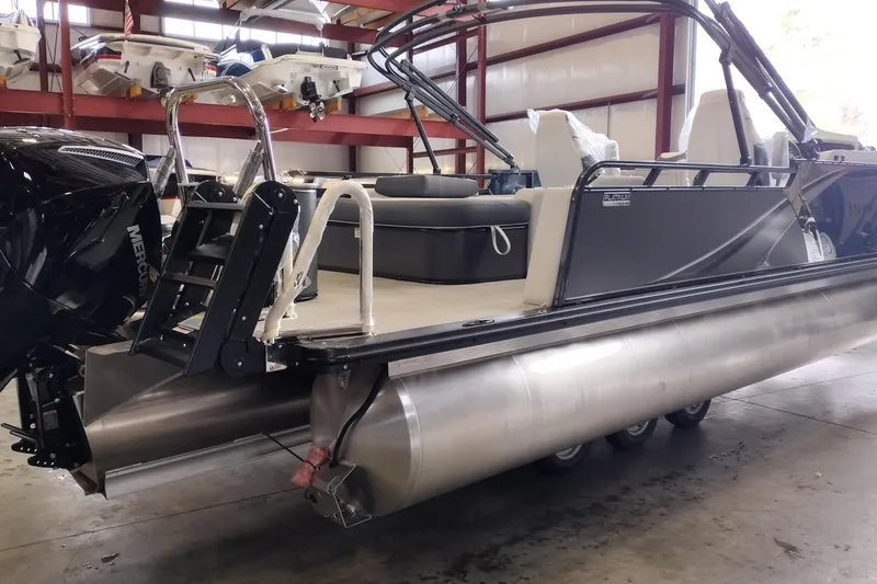 Slide: The Image of Steering wheel of 2026 Tahoe Pontoon 23 LTZ Rear Bench with dashboard controls. - 84