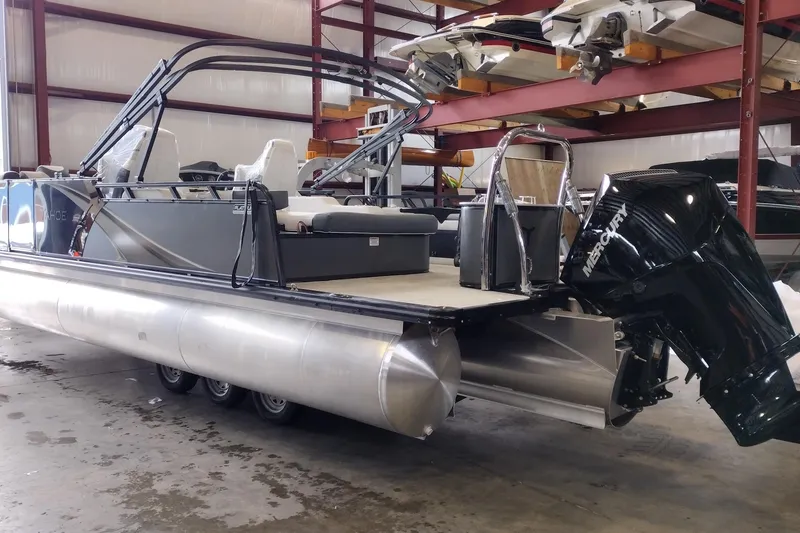 Slide: The Image of 2026 Tahoe Pontoon 23 LTZ Rear Bench interior with cup holders and storage compartment. - 86