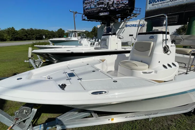 Slide: The Image of 2022 NauticStar 195 XTS boat with Yamaha motor on trailer, outdoor display. - 10