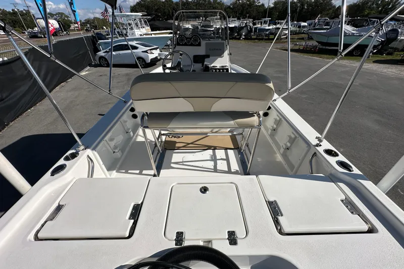 Slide: The Image of 2022 NauticStar 195 XTS boat interior with seating and storage compartments. - 19