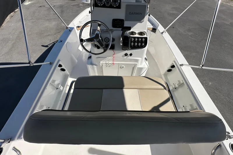 Slide: The Image of 2022 NauticStar 195 XTS boat interior with steering wheel and Garmin navigation system. - 23
