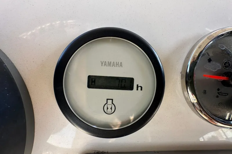 Slide: The Image of Yamaha engine hour meter displaying 70 hours on a 2022 NauticStar 195 XTS boat. - 27