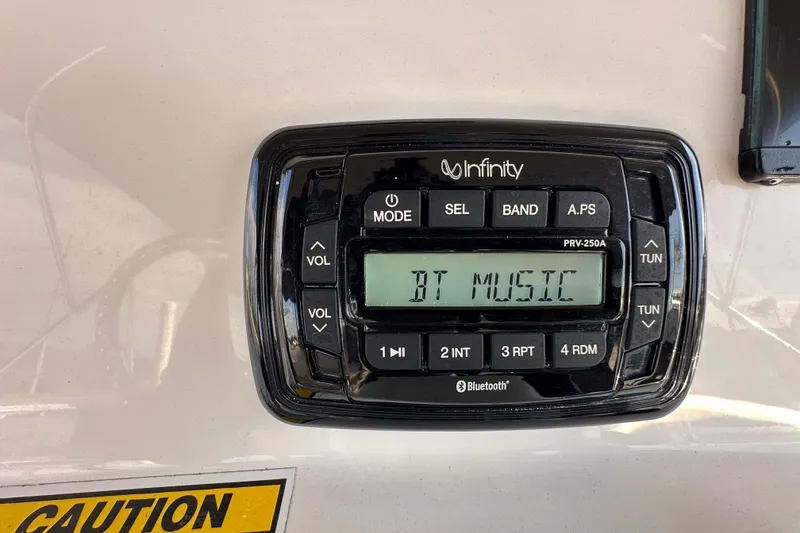 Slide: The Image of Infinity PRV-250A Bluetooth stereo on 2022 NauticStar 195 XTS boat dashboard. - 29