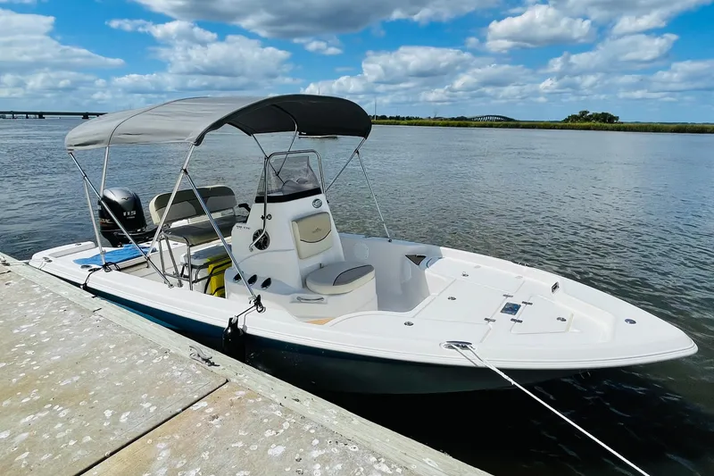 Slide: The Image of 2022 NauticStar 195 XTS boat with 115 horsepower engine, rear view. - 3