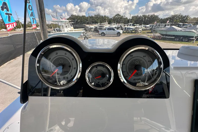 Slide: The Image of Dashboard of 2022 NauticStar 195 XTS boat with speedometer and tachometer gauges. - 30