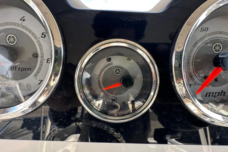 Slide: The Image of Dashboard gauges of a 2022 NauticStar 195 XTS boat, displaying RPM and speed. - 32