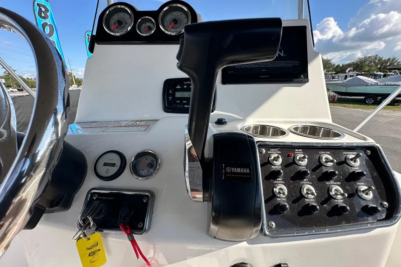 Slide: The Image of 2022 NauticStar 195 XTS boat dashboard with Yamaha controls and gauges. - 34