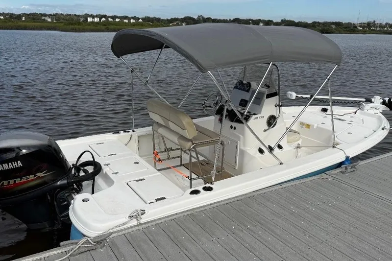 Slide: The Image of 2022 NauticStar 195 XTS boat with 115 horsepower four-stroke engine, rear view. - 4