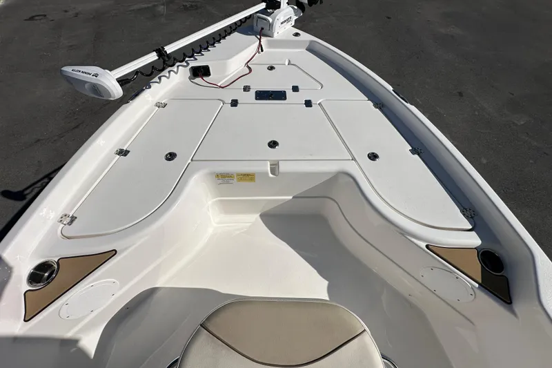 Slide: The Image of 2022 NauticStar 195 XTS boat deck with storage compartments and trolling motor. - 45