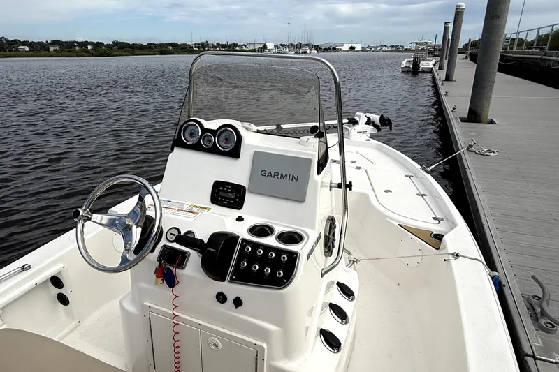 Slide: The Image of Rear view of 2022 NauticStar 195 XTS boat showing propeller and trailer. - 5