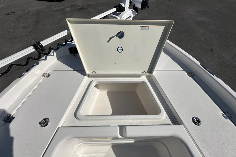 Slide: The Image of 2022 NauticStar 195 XTS boat with open storage compartment on deck. - 53