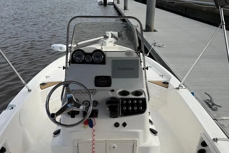 Slide: The Image of 2022 NauticStar 195 XTS boat propeller and lower unit close-up. - 6