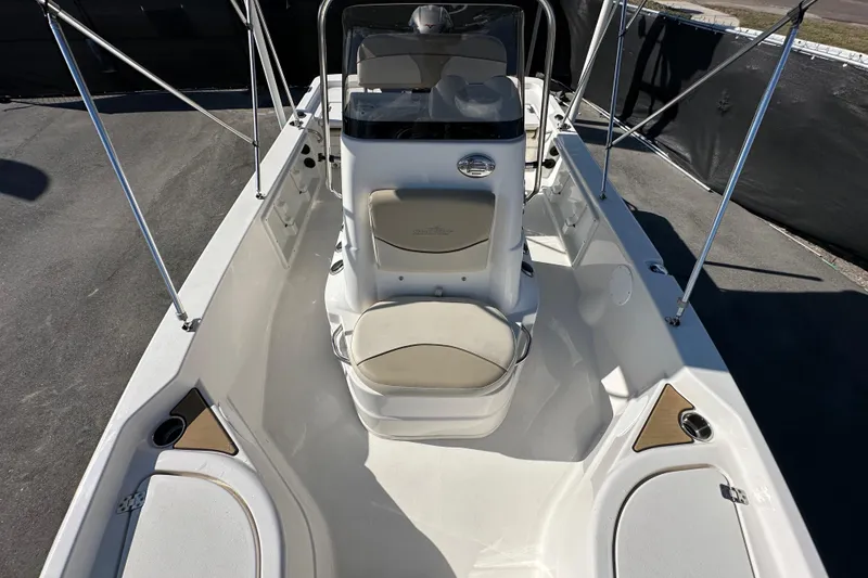 Slide: The Image of 2022 NauticStar 195 XTS boat interior with seating and console, viewed from above. - 66