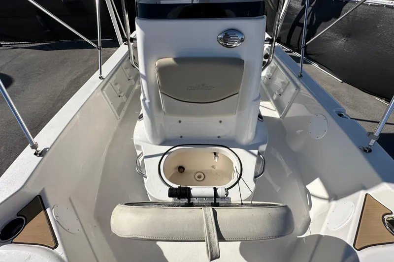 Slide: The Image of 2022 NauticStar 195 XTS boat interior with seating and storage compartments. - 68