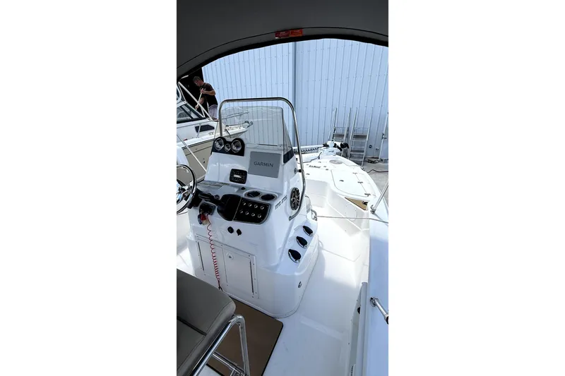 Slide: The Image of Rear view of 2022 NauticStar 195 XTS boat on trailer, showing exhaust and license plate. - 7