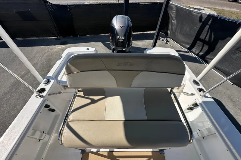 Slide: The Image of 2022 NauticStar 195 XTS boat interior with seating and outboard motor. - 72