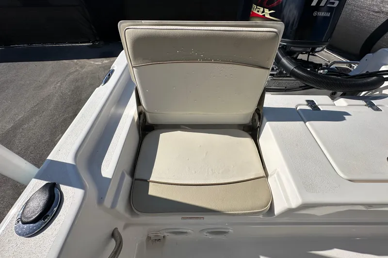 Slide: The Image of 2022 NauticStar 195 XTS boat seat with Yamaha engine in background. - 76