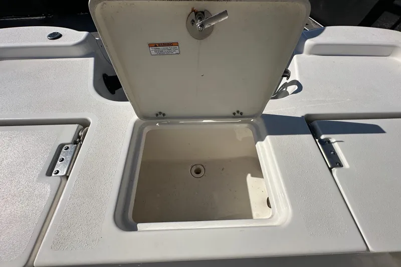 Slide: The Image of Open storage compartment on 2022 NauticStar 195 XTS boat deck. - 80