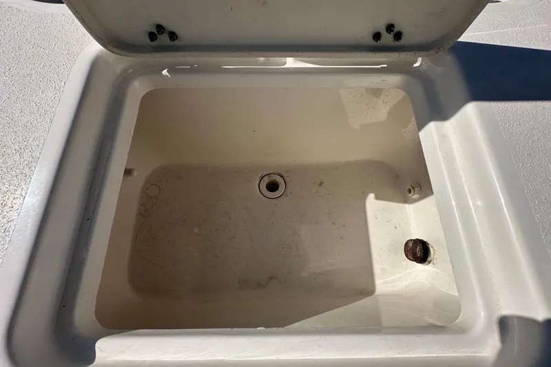 Slide: The Image of Open storage compartment on 2022 NauticStar 195 XTS boat. - 81