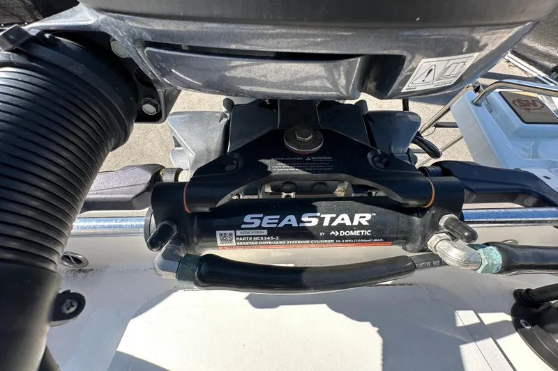 Slide: The Image of Close-up of SeaStar steering system on 2022 NauticStar 195 XTS boat. - 86