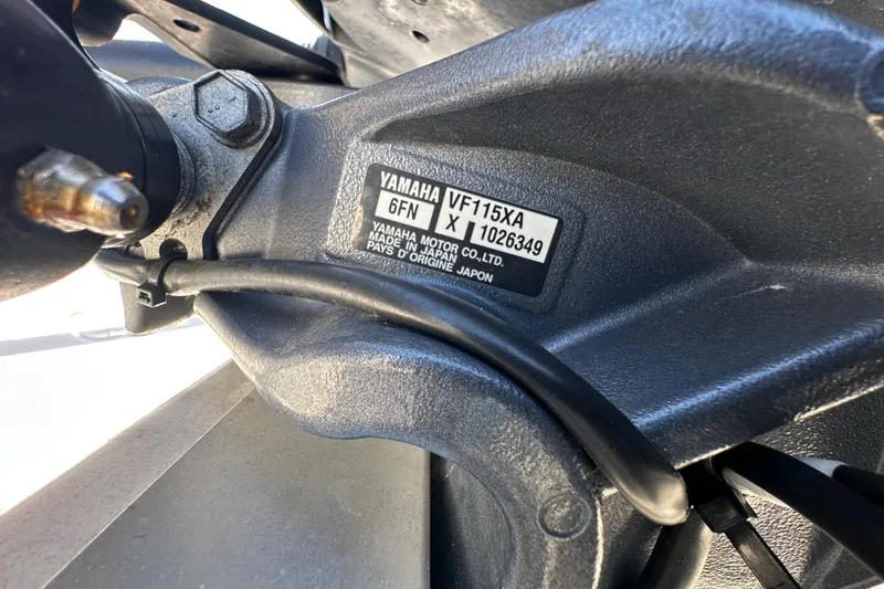 Slide: The Image of Trailer wheel of 2022 NauticStar 195 XTS boat on pavement. - 88