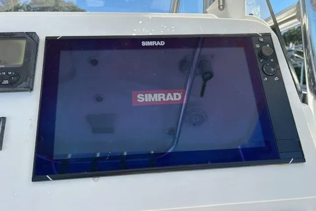 Slide: The Image of Simrad display on 2006 Century 3200 Center Console boat dashboard. - 11