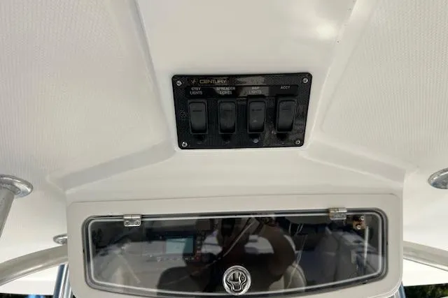 Slide: The Image of Control panel of a 2006 Century 3200 Center Console boat interior. - 18