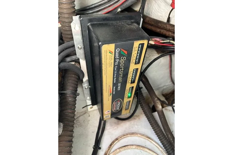 Slide: The Image of Battery charger in a 2006 Century 3200 Center Console boat, showing wiring and connections. - 23
