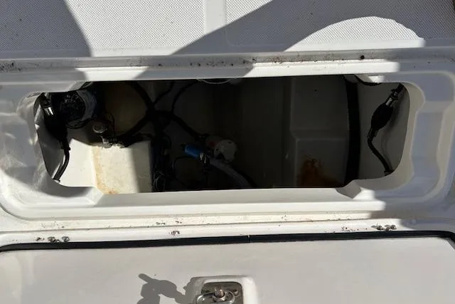 Slide: The Image of Open compartment of a 2006 Century 3200 Center Console boat, showing internal components. - 27