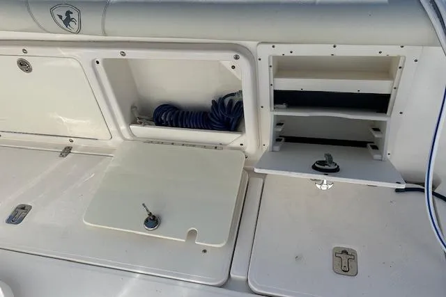 Slide: The Image of 2006 Century 3200 Center Console boat storage compartments and utility area. - 28