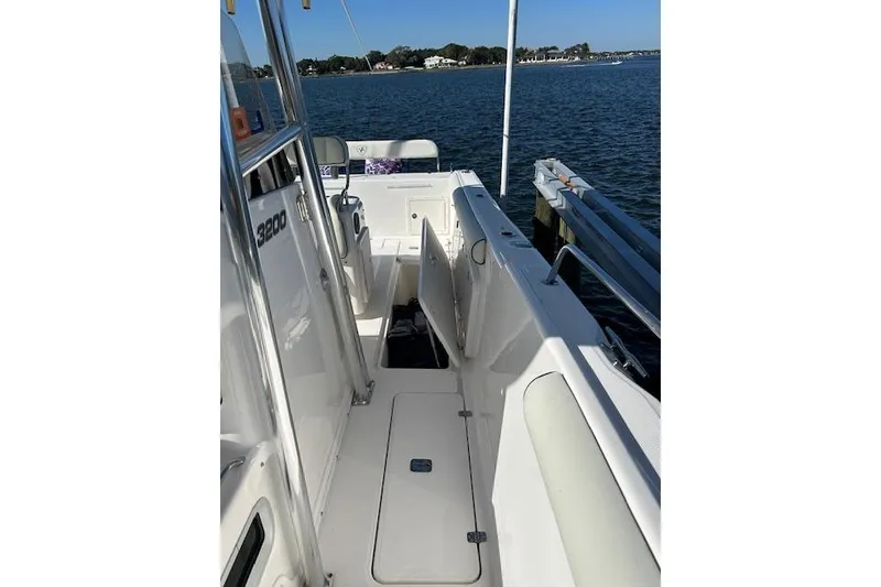 Slide: The Image of 2006 Century 3200 Center Console boat docked by the water. - 33