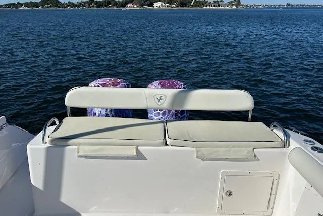 Slide: The Image of 2006 Century 3200 Center Console boat with dual engines on a calm sea. - 39