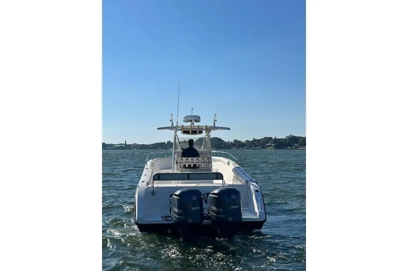 Slide: The Image of 2006 Century 3200 Center Console boat on water with dual Yamaha engines. - 7