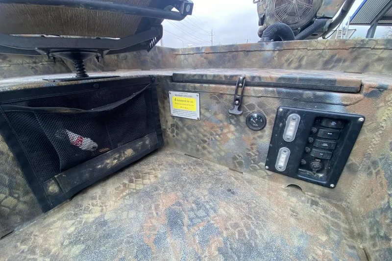 Slide: The Image of Interior of 2023 Excel F86 boat with control panel and storage net. - 12