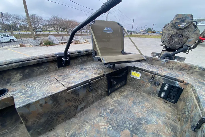 Slide: The Image of 2023 Excel F86 boat interior with camouflage design and seating. - 13