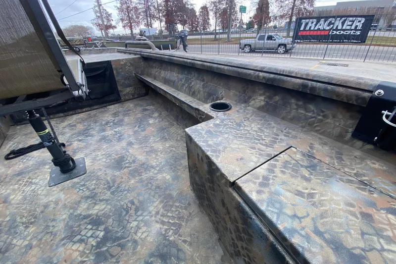 Slide: The Image of 2023 Excel F86 boat interior with camouflage design and seating area. - 14