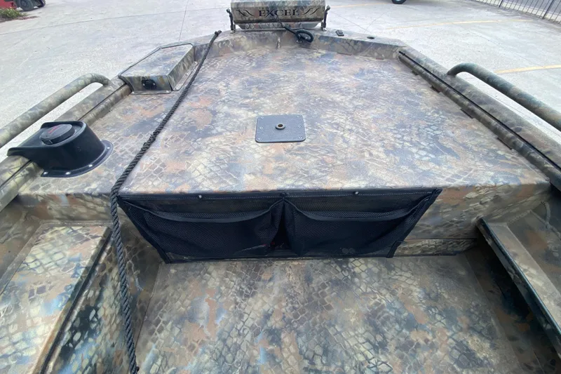 Slide: The Image of 2023 Excel F86 boat with camouflage pattern and storage compartments. - 15