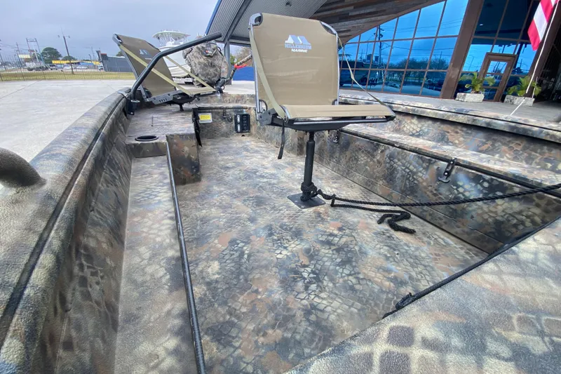 Slide: The Image of 2023 Excel F86 boat interior with camouflage design and swivel seat. - 17