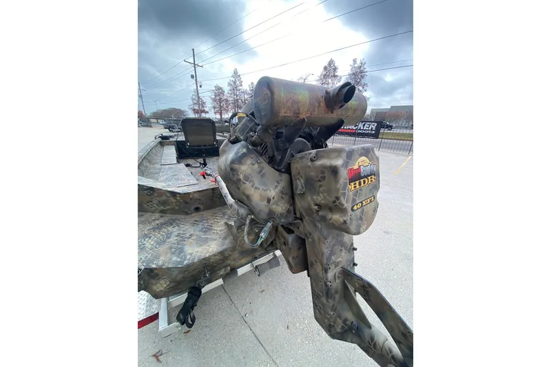 Slide: The Image of Camouflage-patterned Excel F86 boat with Mud Buddy HDR 40 EFI motor, 2023 model. - 19