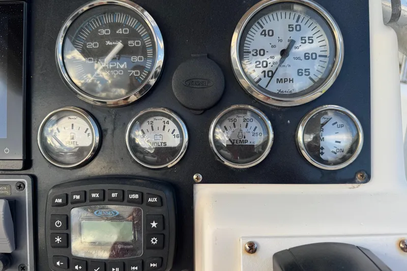 Slide: The Image of Dashboard of a 2001 Sport-Craft 260 Center Console with gauges and controls. - 10