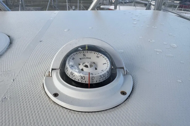 Slide: The Image of Compass on 2001 Sport-Craft 260 Center Console boat deck, showing navigation details. - 11