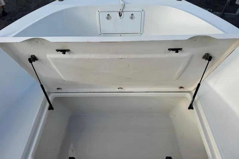 Slide: The Image of Open storage compartment on 2001 Sport-Craft 260 Center Console boat. - 16