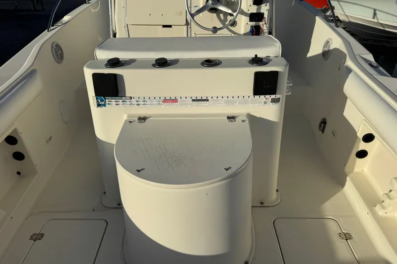 Slide: The Image of 2001 Sport-Craft 260 Center Console boat interior with steering wheel and control panel. - 21