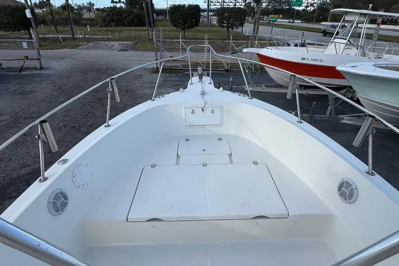 Slide: The Image of 2001 Sport-Craft 260 Center Console boat interior with spacious deck and seating. - 6