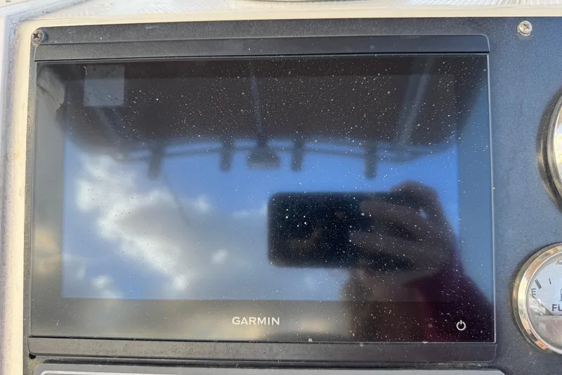 Slide: The Image of Garmin display on 2001 Sport-Craft 260 Center Console boat dashboard. - 8