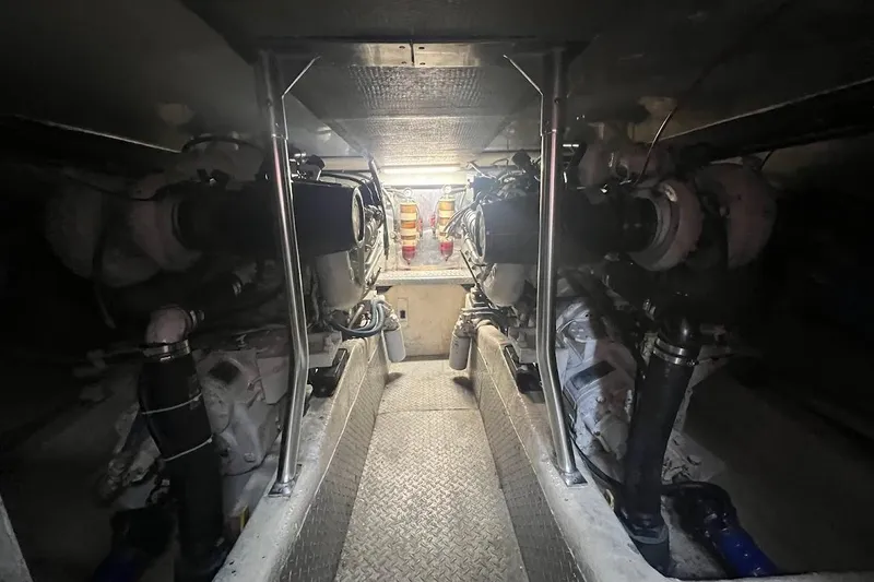 Slide: The Image of Interior of 1996 Ocean Yachts 48 Super Sport, featuring carpeted flooring and modern furnishings. - 10