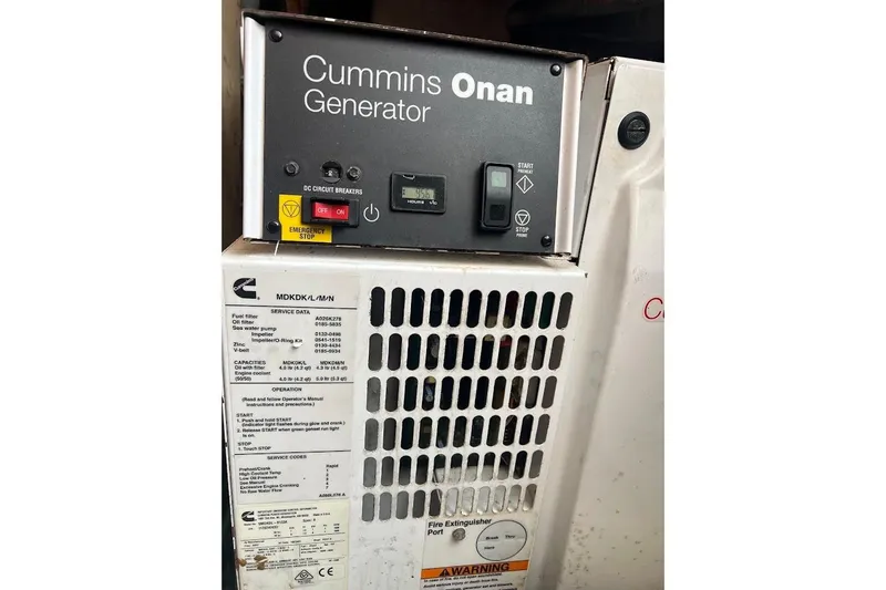 Slide: The Image of Interior of 1996 Ocean Yachts 48 Super Sport with TV, seating, and window view. - 13