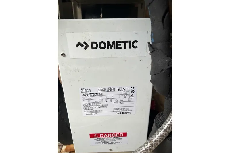 Slide: The Image of Cozy bedroom interior of 1996 Ocean Yachts 48 Super Sport with floral bedding and storage. - 17