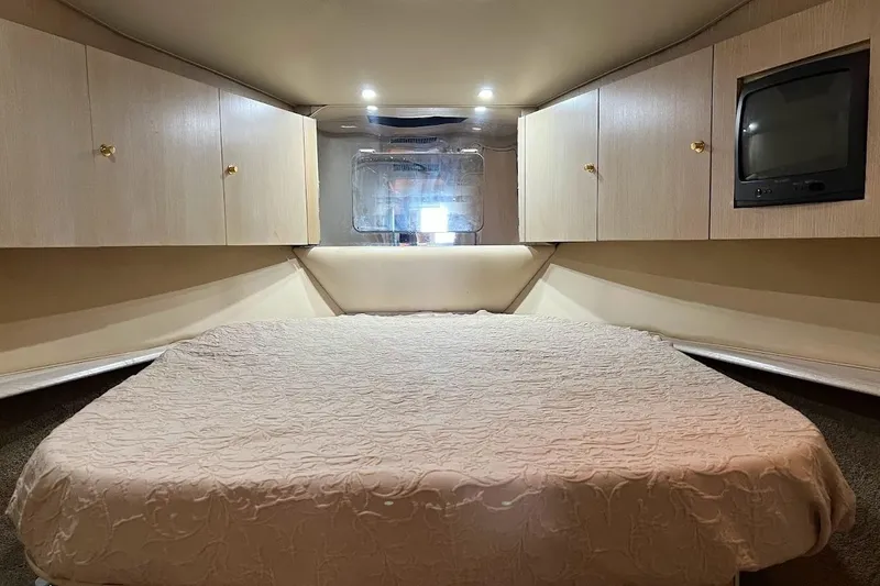 Slide: The Image of Cockpit of 1996 Ocean Yachts 48 Super Sport with navigation equipment and steering wheel. - 48